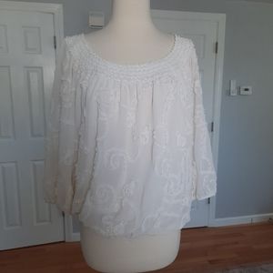 White floral embossed flowy top.